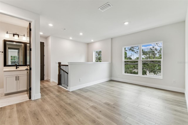 441 42nd Ave NE, Saint Petersburg, FL 33703 - empty room featuring light wood-type flooring and recessed lighting