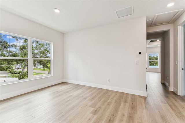 441 42nd Ave NE, Saint Petersburg, FL 33703 - empty room featuring light wood-style flooring, attic access, and recessed lighting