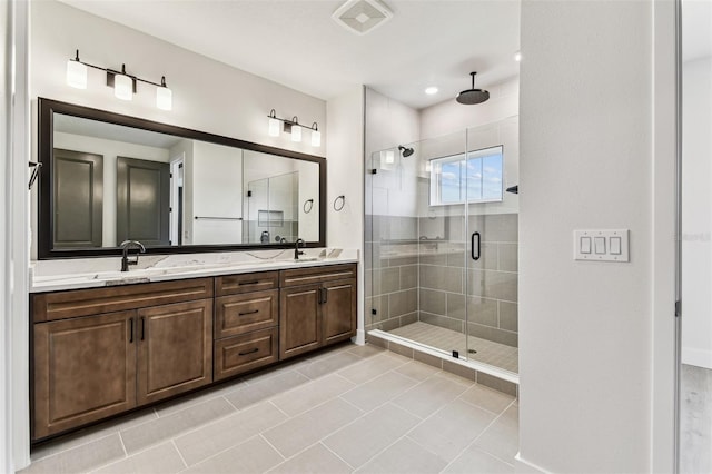 441 42nd Ave NE, Saint Petersburg, FL 33703 - bathroom with a stall shower, double vanity, and tile patterned floors