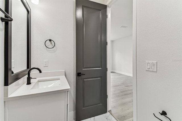 441 42nd Ave NE, Saint Petersburg, FL 33703 - bathroom with vanity and a textured wall