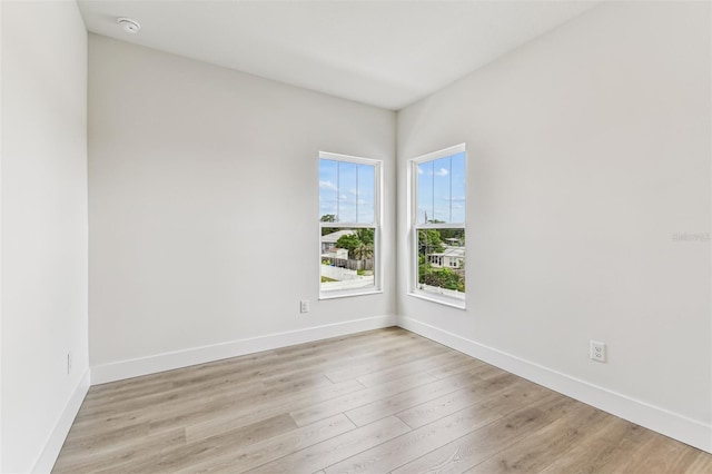 441 42nd Ave NE, Saint Petersburg, FL 33703 - empty room featuring light wood-style floors and baseboards