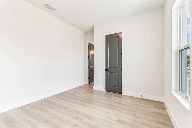 441 42nd Ave NE, Saint Petersburg, FL 33703 - spare room featuring light wood finished floors and baseboards
