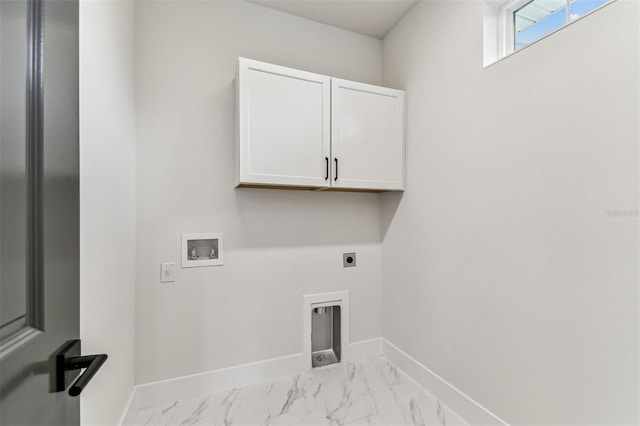441 42nd Ave NE, Saint Petersburg, FL 33703 - washroom featuring cabinet space, electric dryer hookup, washer hookup, and light marble finish floors