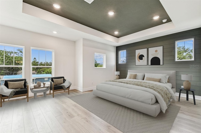 441 42nd Ave NE, Saint Petersburg, FL 33703 - bedroom featuring a tray ceiling, light wood-type flooring, and recessed lighting