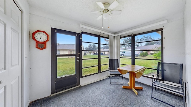 sunroom with ceiling fan