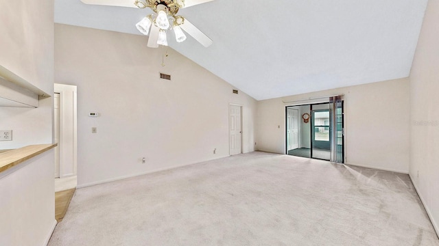 unfurnished living room with high vaulted ceiling, light colored carpet, and ceiling fan