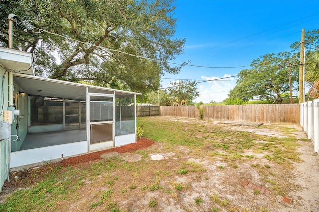 view of yard featuring a sunroom