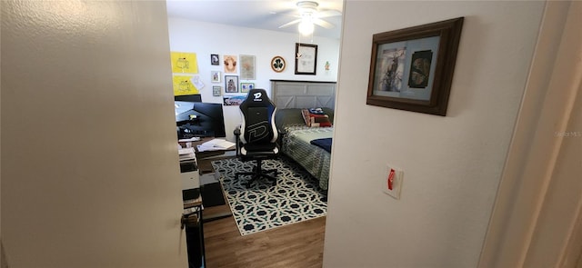 bedroom featuring wood-type flooring and ceiling fan