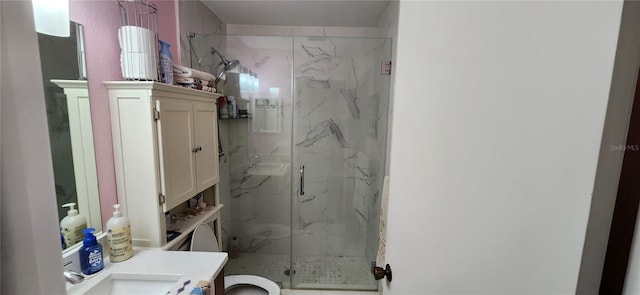 bathroom with vanity and a shower with door