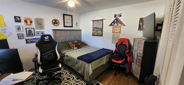 bedroom featuring dark hardwood / wood-style floors and ceiling fan