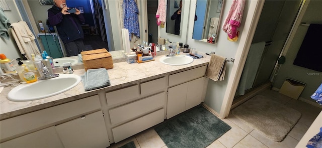 bathroom with vanity and tile patterned flooring