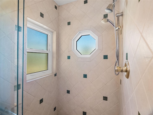 bathroom with a tile shower