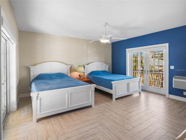 bedroom with light parquet flooring, access to exterior, a wall unit AC, and french doors