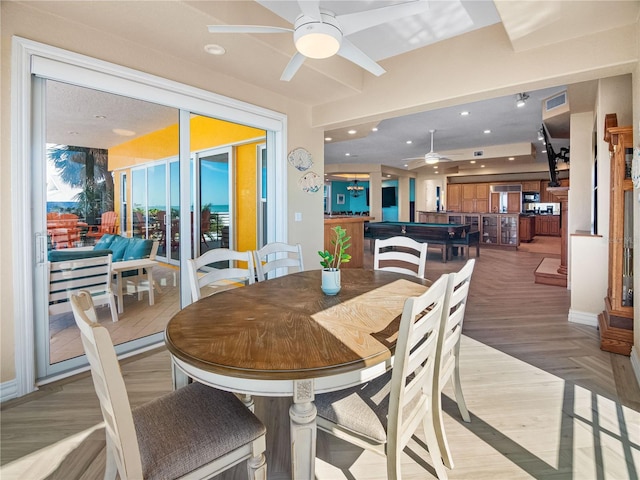 dining area featuring hardwood / wood-style floors and ceiling fan