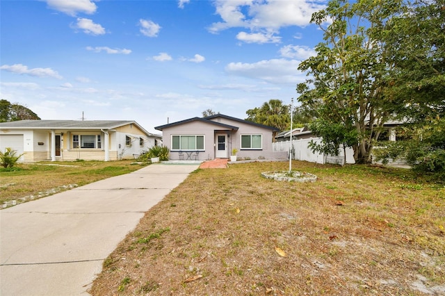 ranch-style house with a front lawn