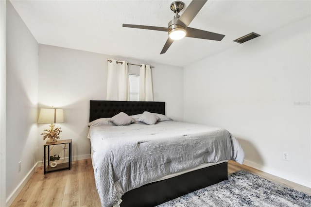 bedroom featuring ceiling fan and light hardwood / wood-style floors