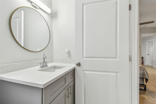 bathroom featuring vanity and hardwood / wood-style floors