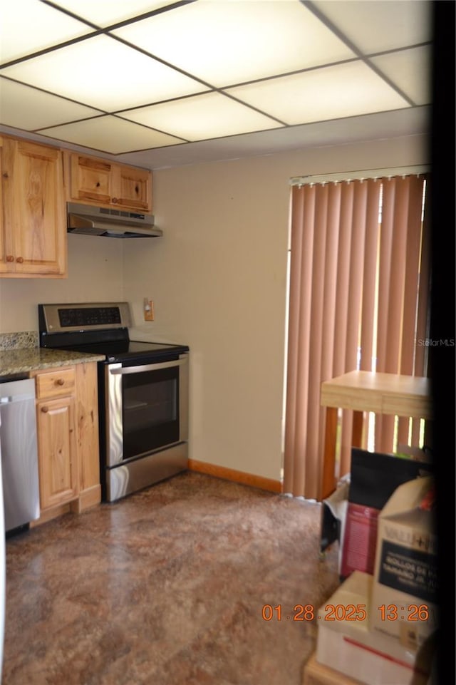 kitchen featuring appliances with stainless steel finishes, light stone countertops, and light brown cabinets