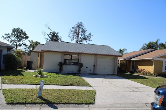 single story home featuring a garage and a front yard