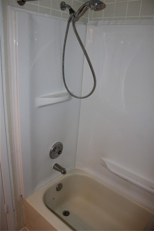 bathroom with shower / tub combination