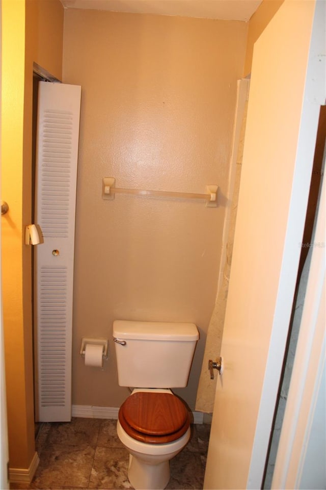 bathroom featuring tile patterned floors and toilet