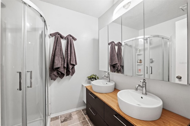 bathroom with vanity and an enclosed shower