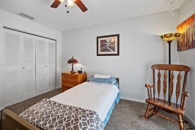 carpeted bedroom with a closet and ceiling fan