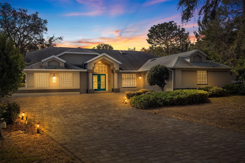 ranch-style home featuring french doors