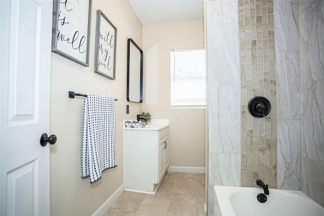 bathroom featuring vanity and tiled shower / bath combo