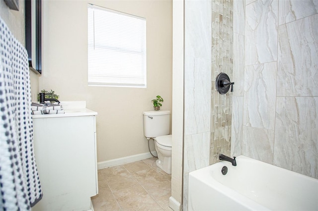 full bathroom featuring tiled shower / bath combo, vanity, tile patterned flooring, and toilet