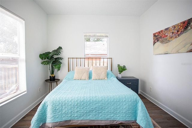 bedroom featuring dark hardwood / wood-style floors