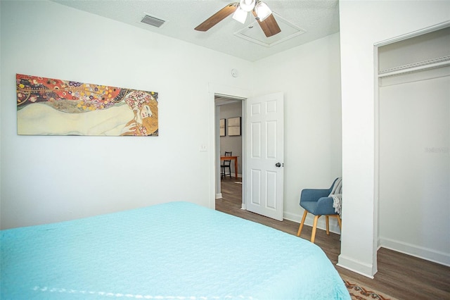 bedroom featuring dark hardwood / wood-style floors and ceiling fan