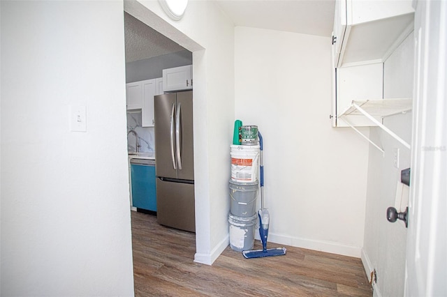 interior space featuring wood-type flooring and sink