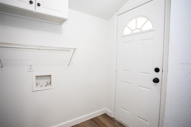 laundry room featuring dark wood-type flooring, cabinets, and hookup for a washing machine