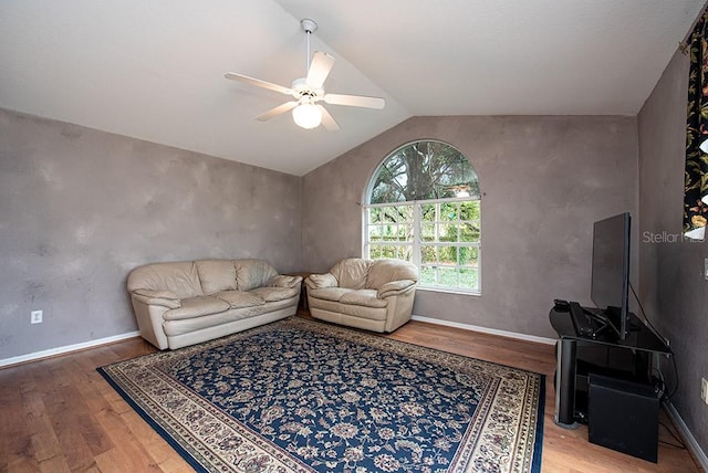 living room with ceiling fan, lofted ceiling, and wood-type flooring