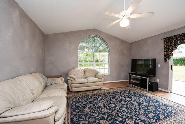 living room featuring vaulted ceiling, hardwood / wood-style floors, and ceiling fan