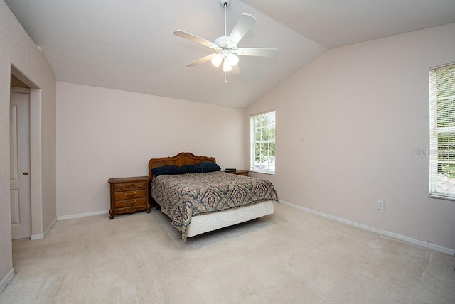 carpeted bedroom featuring vaulted ceiling and ceiling fan