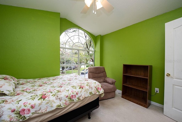 carpeted bedroom featuring ceiling fan and lofted ceiling