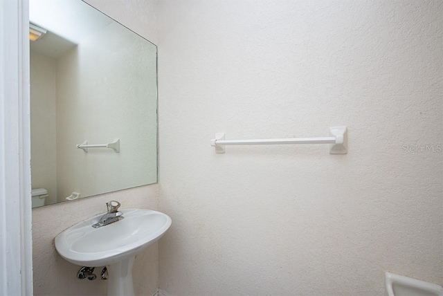 bathroom with sink and toilet