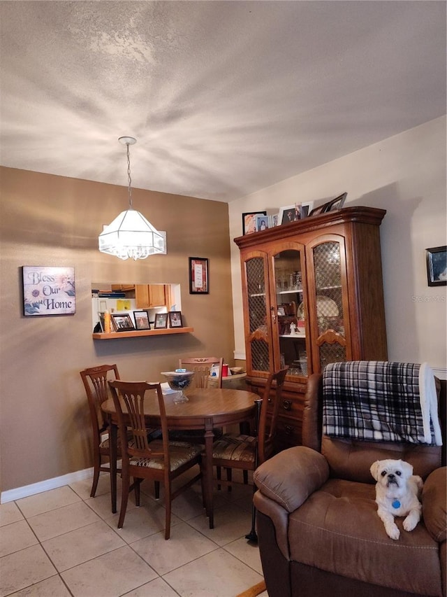 dining area featuring light tile patterned flooring