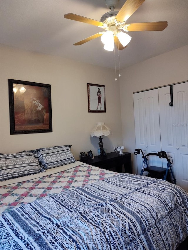 bedroom featuring ceiling fan and a closet