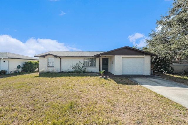 ranch-style house with a garage and a front lawn