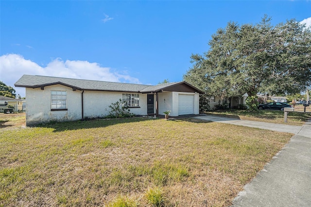 ranch-style home with a garage and a front yard