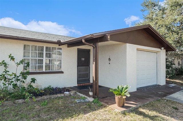 ranch-style home with a garage