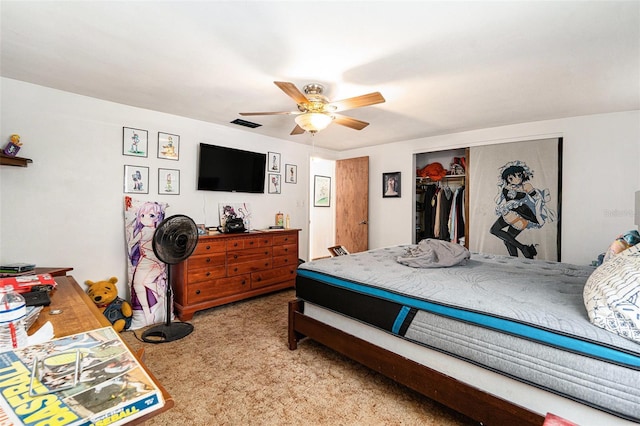 bedroom featuring light colored carpet, a closet, and ceiling fan