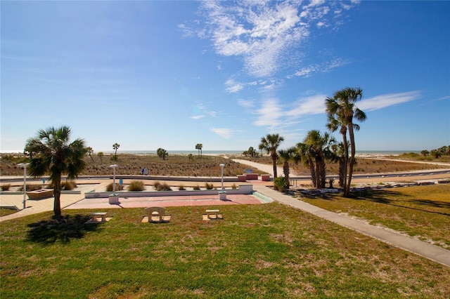 surrounding community featuring a lawn and a rural view