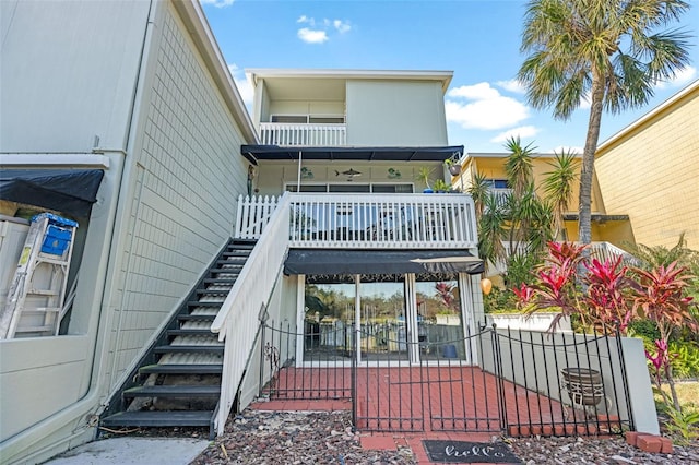 rear view of property with a balcony