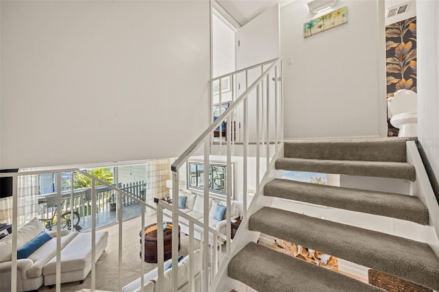 staircase with a wall of windows