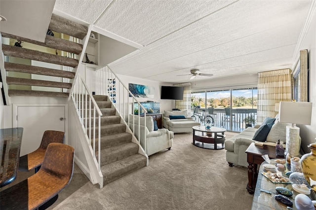 living room featuring ceiling fan and carpet