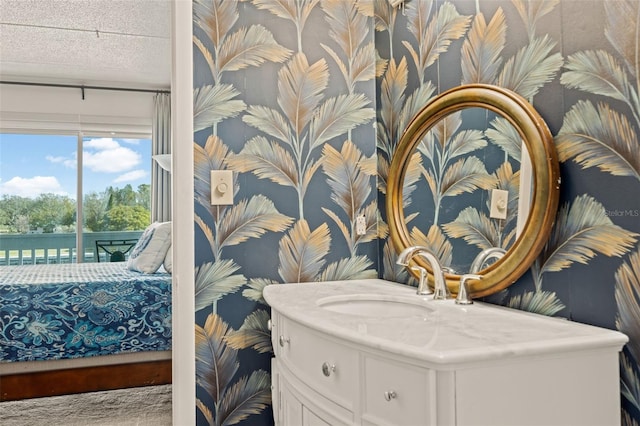 bathroom featuring vanity and a textured ceiling